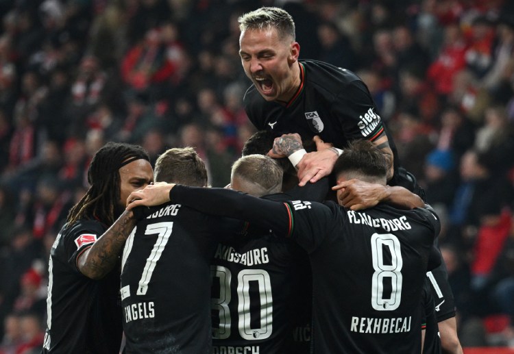 Augsburg celebrate winning their Bundesliga game against Union Berlin at WWK Arena